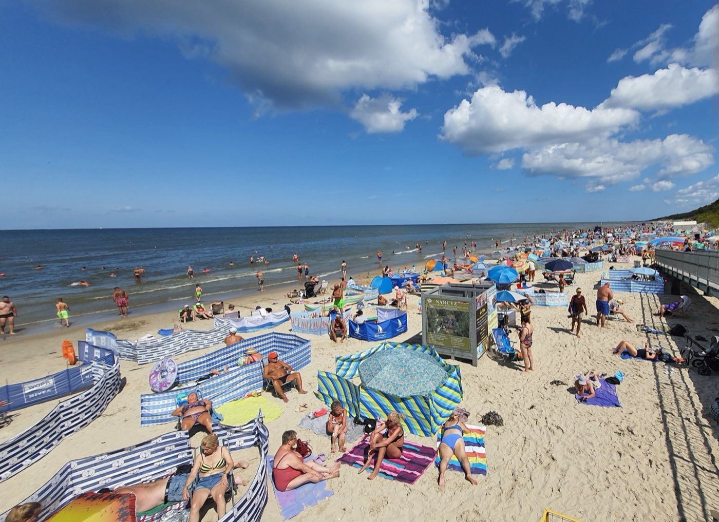 Wide sandy beach in Międzywodzie in summer 2025